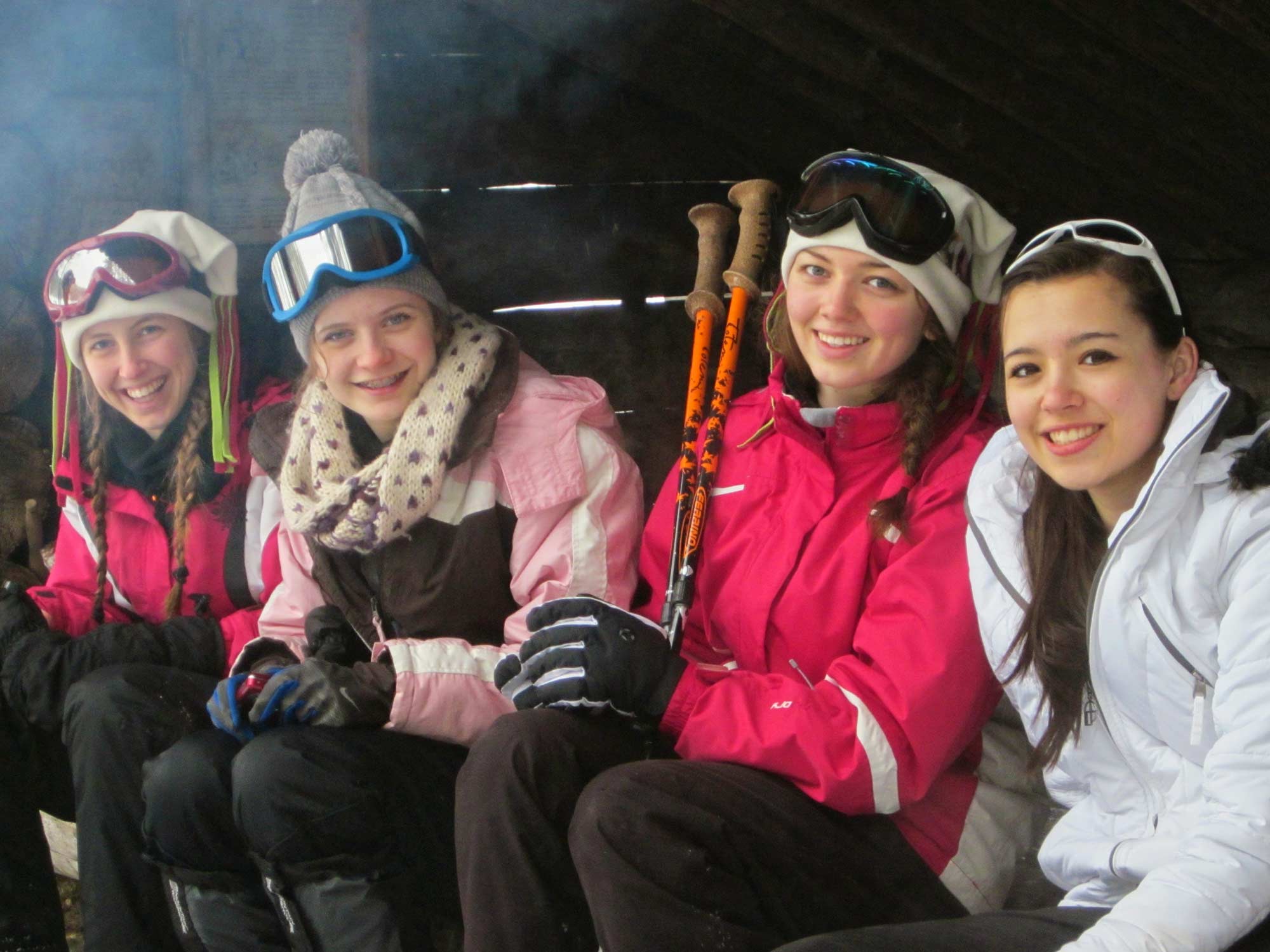 A grouop of adults and kids on snowshoes