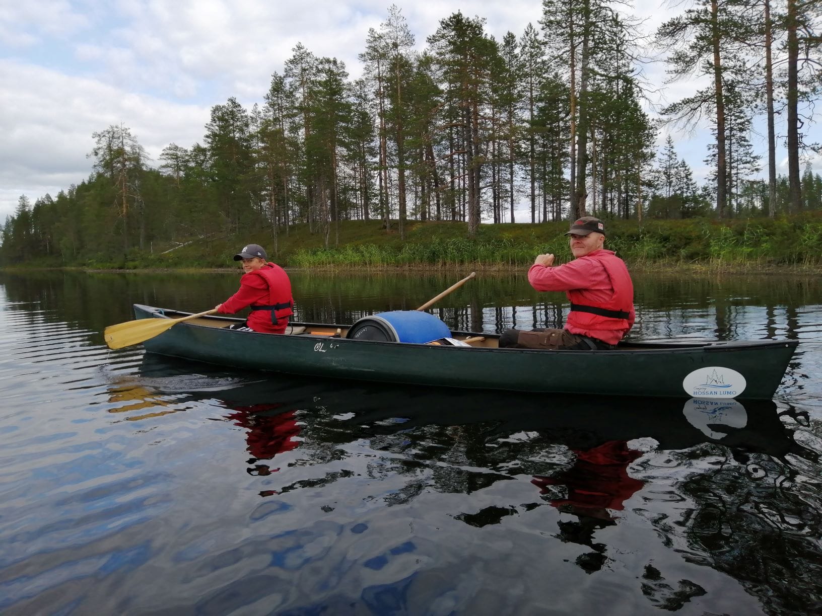 A man and and a boy canoeing